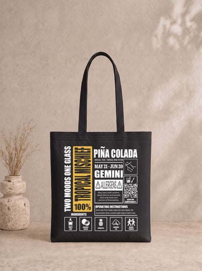 Mr.B İkizler Burcu Bez Çanta · Zodiac of Cocktails · Piña Colada · Siyah · ürün görseli, baskılı arka yüz
